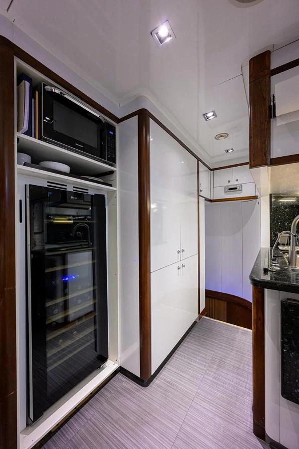 a kitchen with a microwave oven aboard ARTHUR’S WAY Yacht for Sale