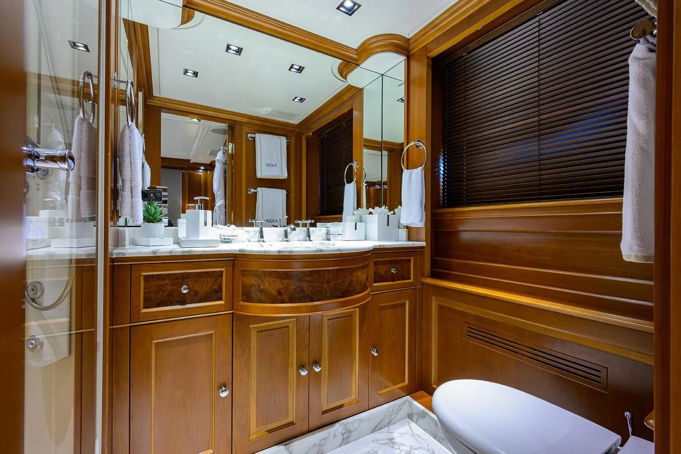 a bathroom with a sink and a mirror aboard ARTHUR’S WAY Yacht for Sale