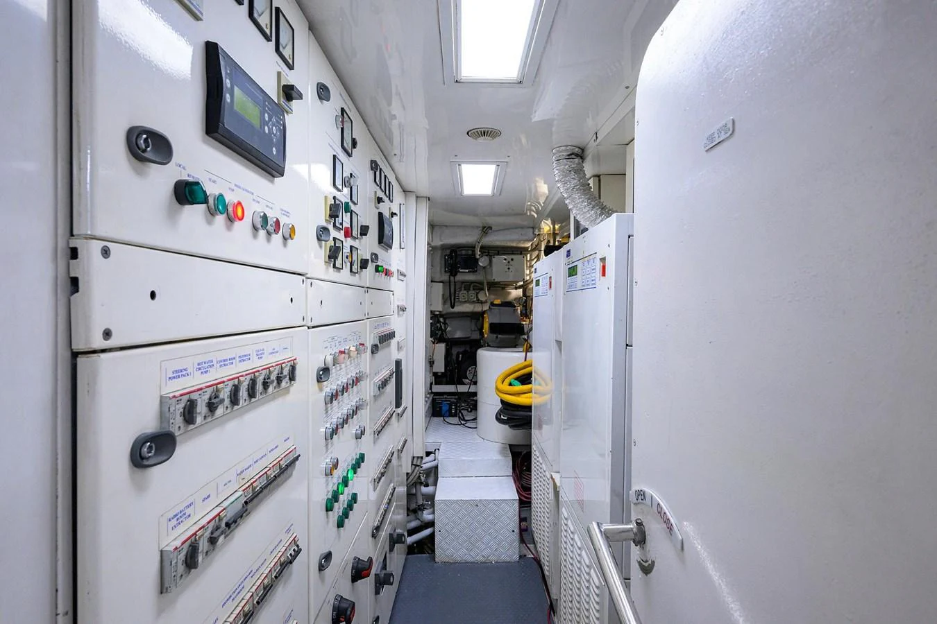 a room with white walls and white cabinets aboard ARTHUR’S WAY Yacht for Sale