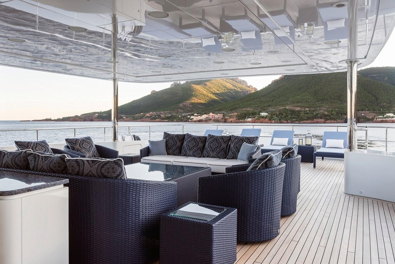 a large lounge area with a large white tent and a large body of water aboard MY LEGACY Yacht for Sale