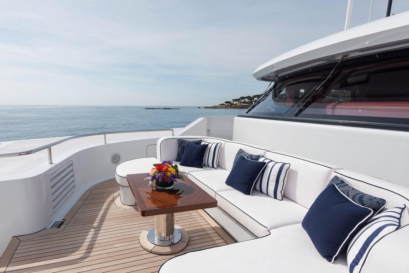 a white couch on a deck overlooking the ocean aboard MY LEGACY Yacht for Sale