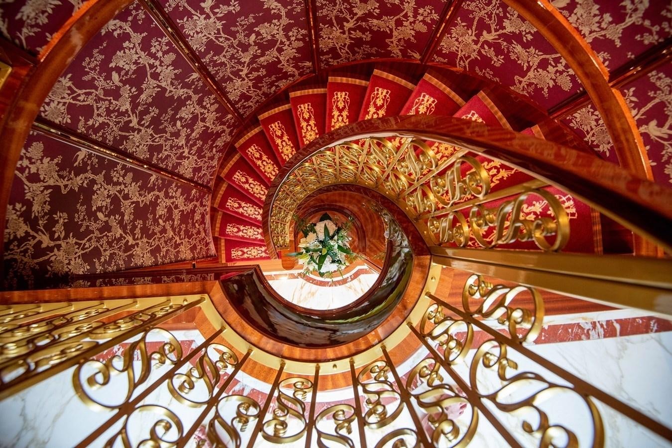 a large ornate ceiling with a round window aboard MY LEGACY Yacht for Sale