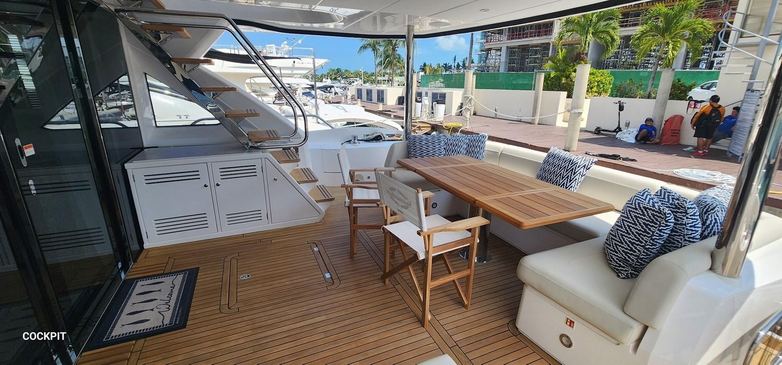 a room with a table and chairs aboard EL 5 MARES Yacht for Sale