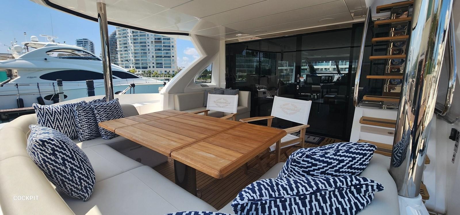a room with a table and chairs aboard EL 5 MARES Yacht for Sale