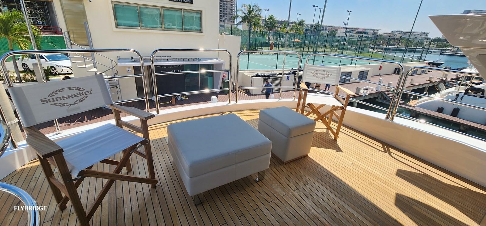 a deck with chairs and tables aboard EL 5 MARES Yacht for Sale