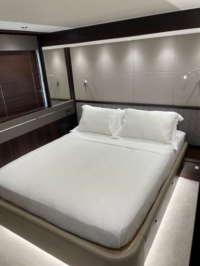 a bed with white sheets aboard EL 5 MARES Yacht for Sale