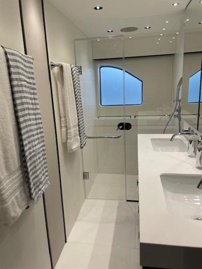 a bathroom with a sink and a towel on the wall aboard EL 5 MARES Yacht for Sale