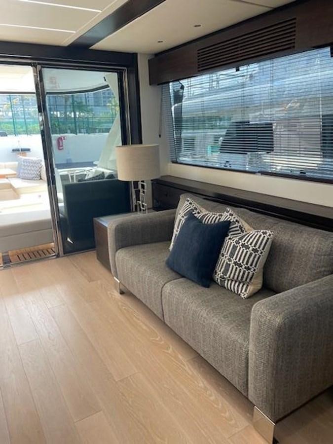 a living room with a large window aboard EL 5 MARES Yacht for Sale