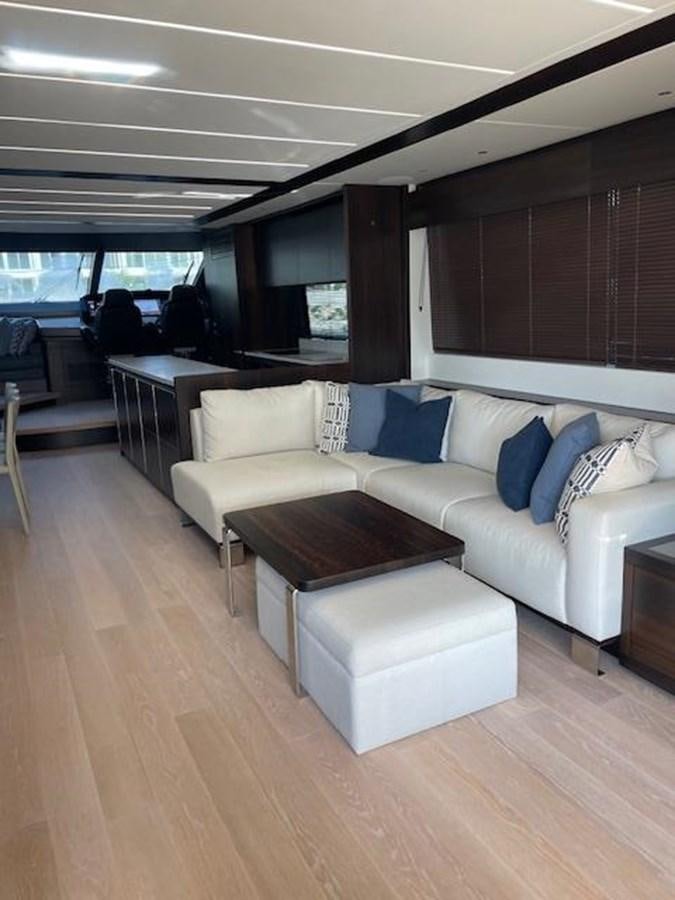 a living room with a couch and a table aboard EL 5 MARES Yacht for Sale