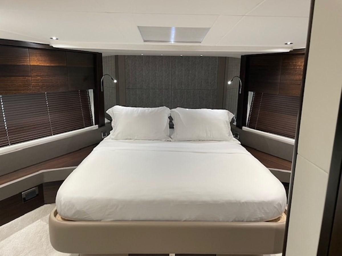 a bed with white sheets aboard EL 5 MARES Yacht for Sale