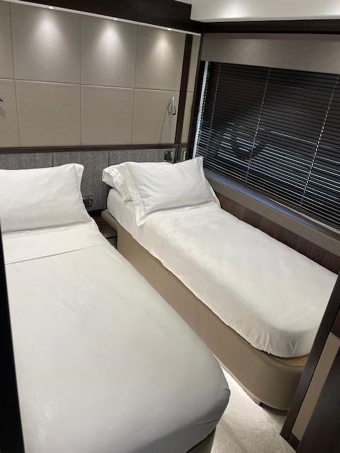 a bed with white sheets aboard EL 5 MARES Yacht for Sale