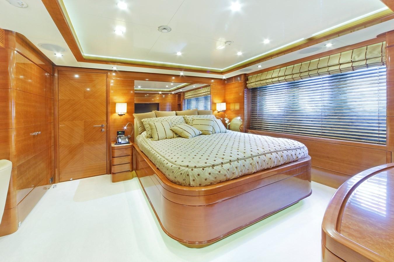 a large bedroom with a large bed aboard HARMONY III Yacht for Sale