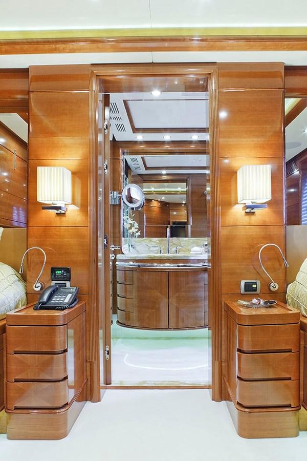 a wooden cabinet with a phone and a radio aboard HARMONY III Yacht for Sale