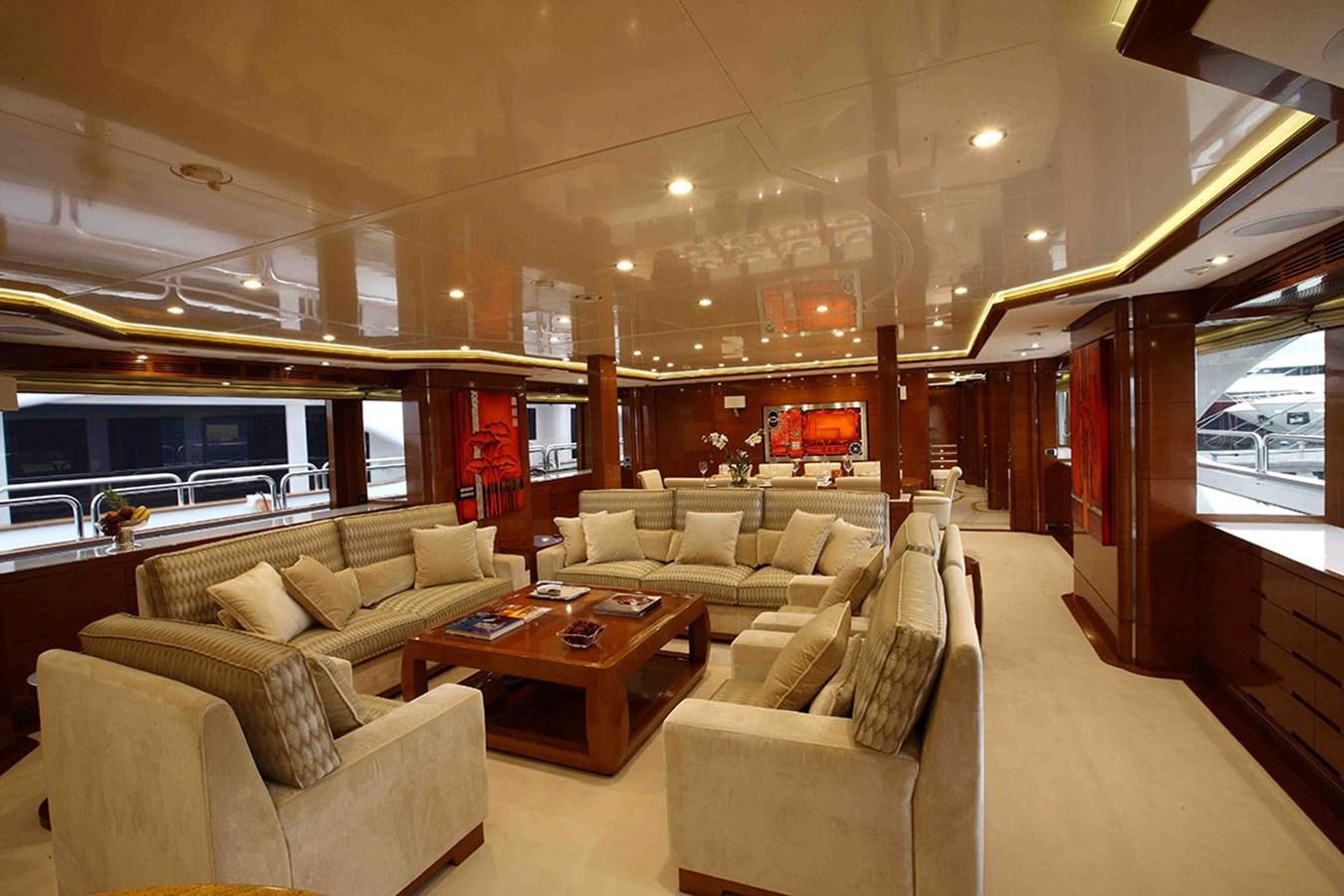 a living room with a large window aboard HARMONY III Yacht for Sale