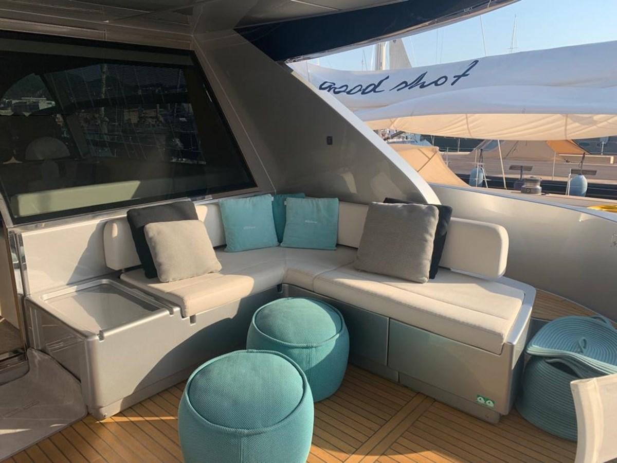 a couch and a chair in a room aboard CHILUCE Yacht for Sale