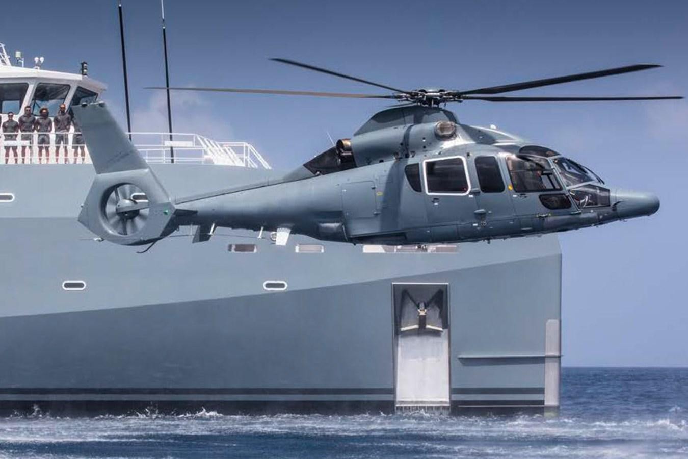 a helicopter flying over a boat aboard WINGMAN Yacht for Sale