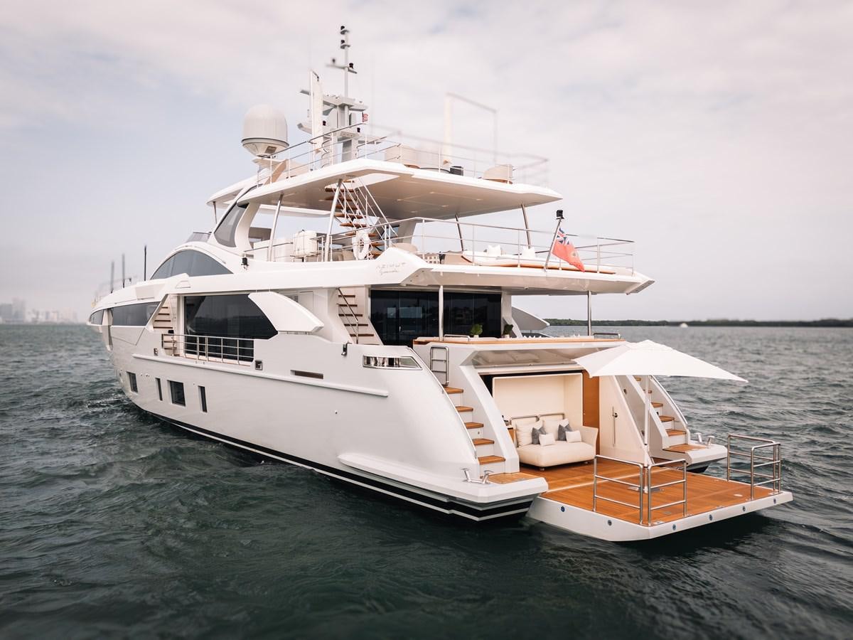a large white boat in the water aboard AMICO Yacht for Sale