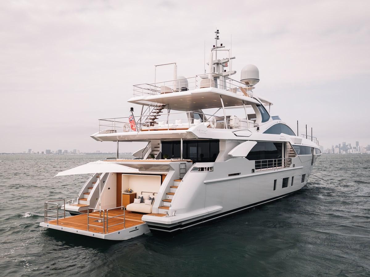 a large white boat in the water aboard AMICO Yacht for Sale