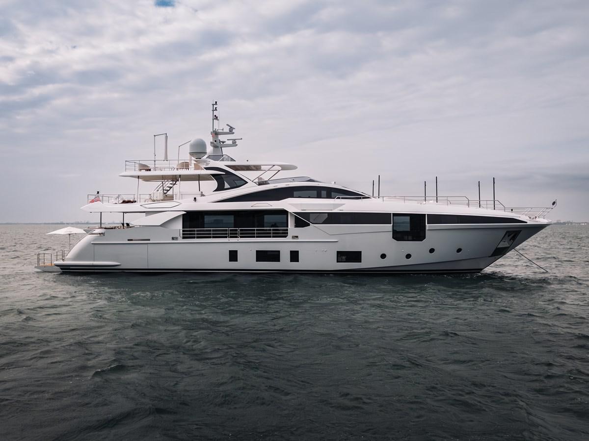 a white yacht in the water aboard AMICO Yacht for Sale