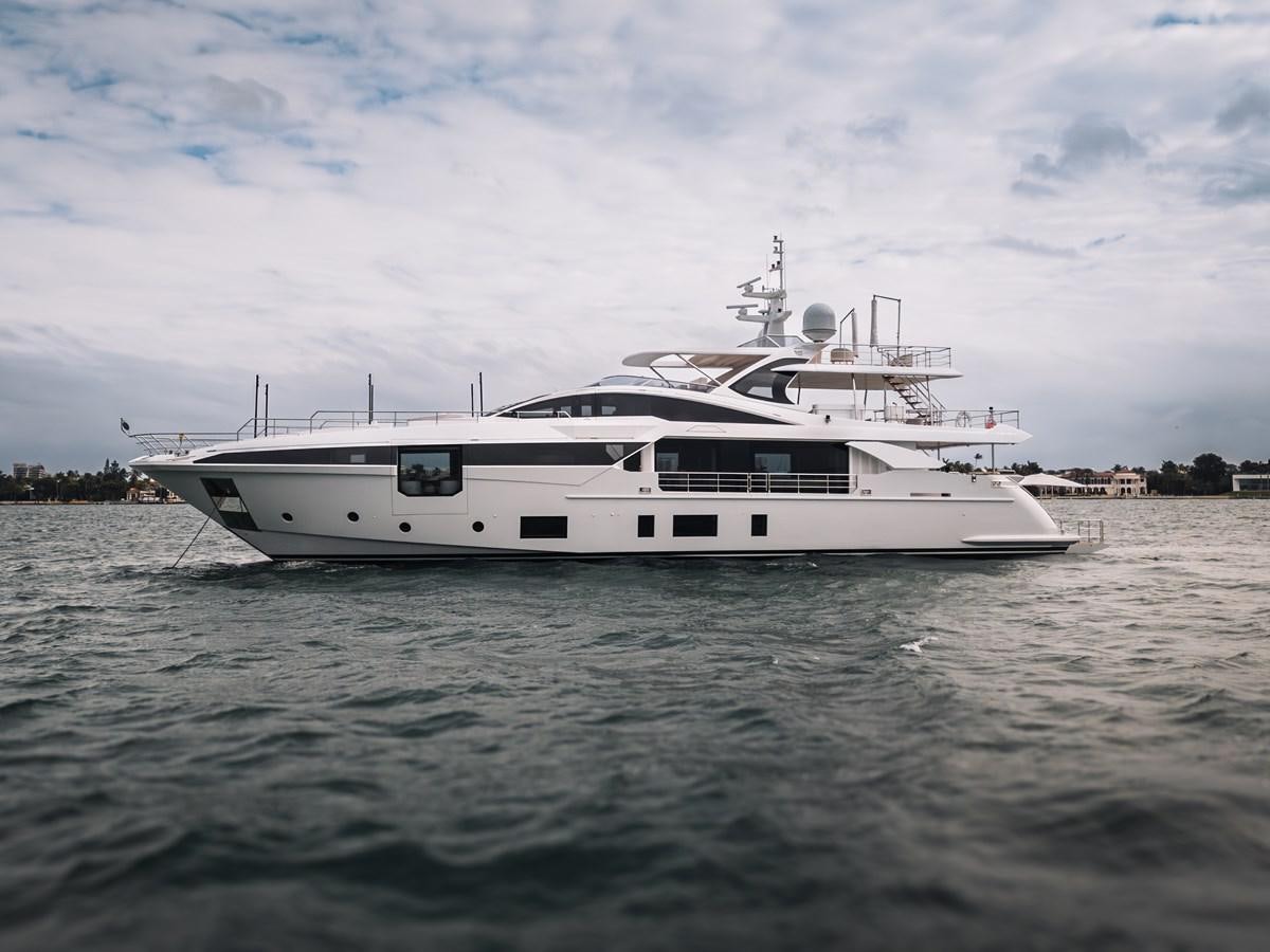 a white yacht in the water aboard AMICO Yacht for Sale