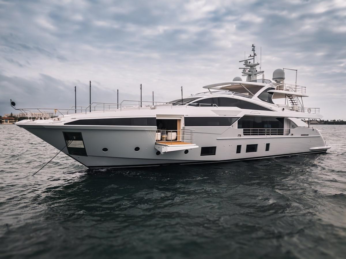 a white yacht on the water aboard AMICO Yacht for Sale