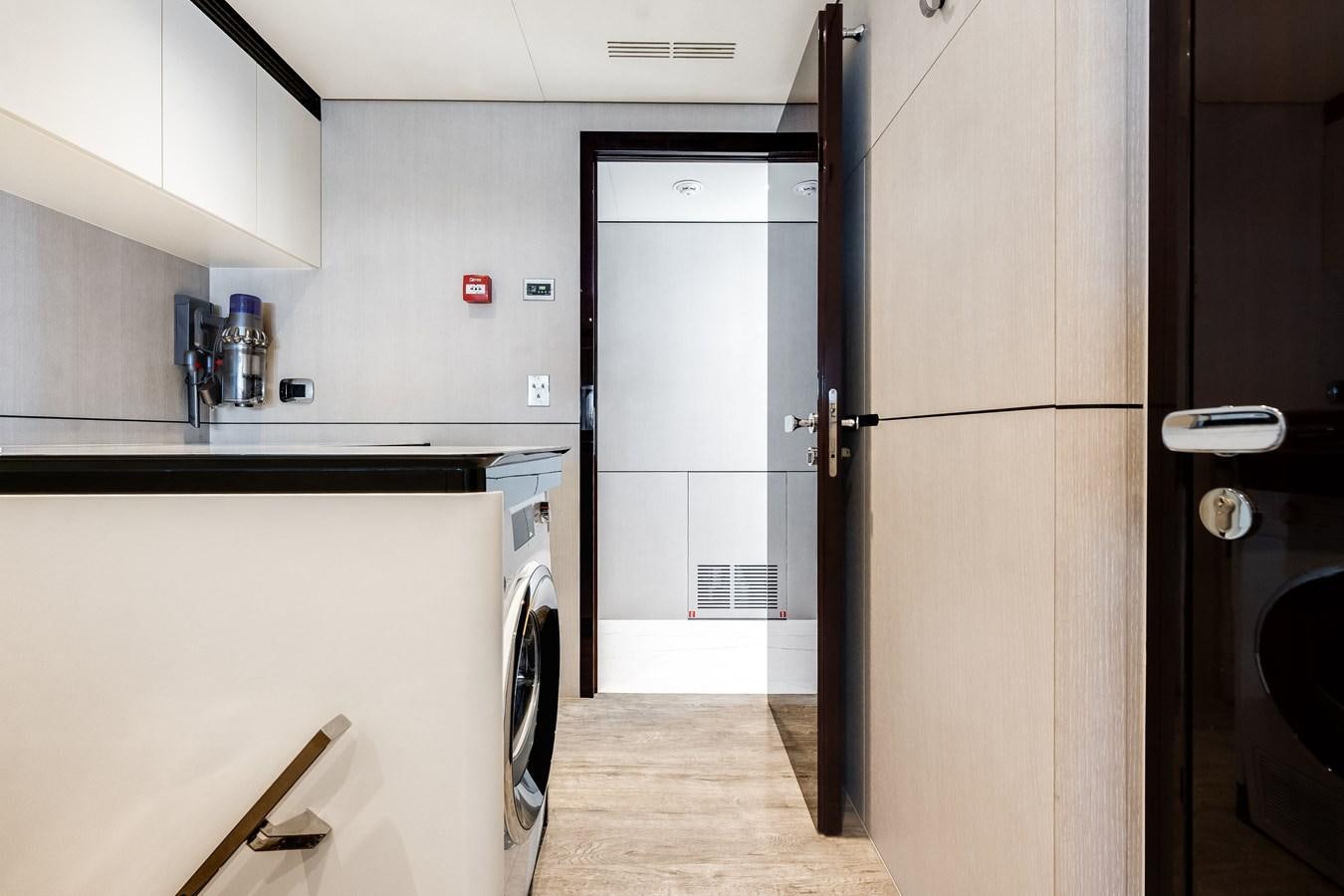 a kitchen with a refrigerator and a sink aboard AMICO Yacht for Sale