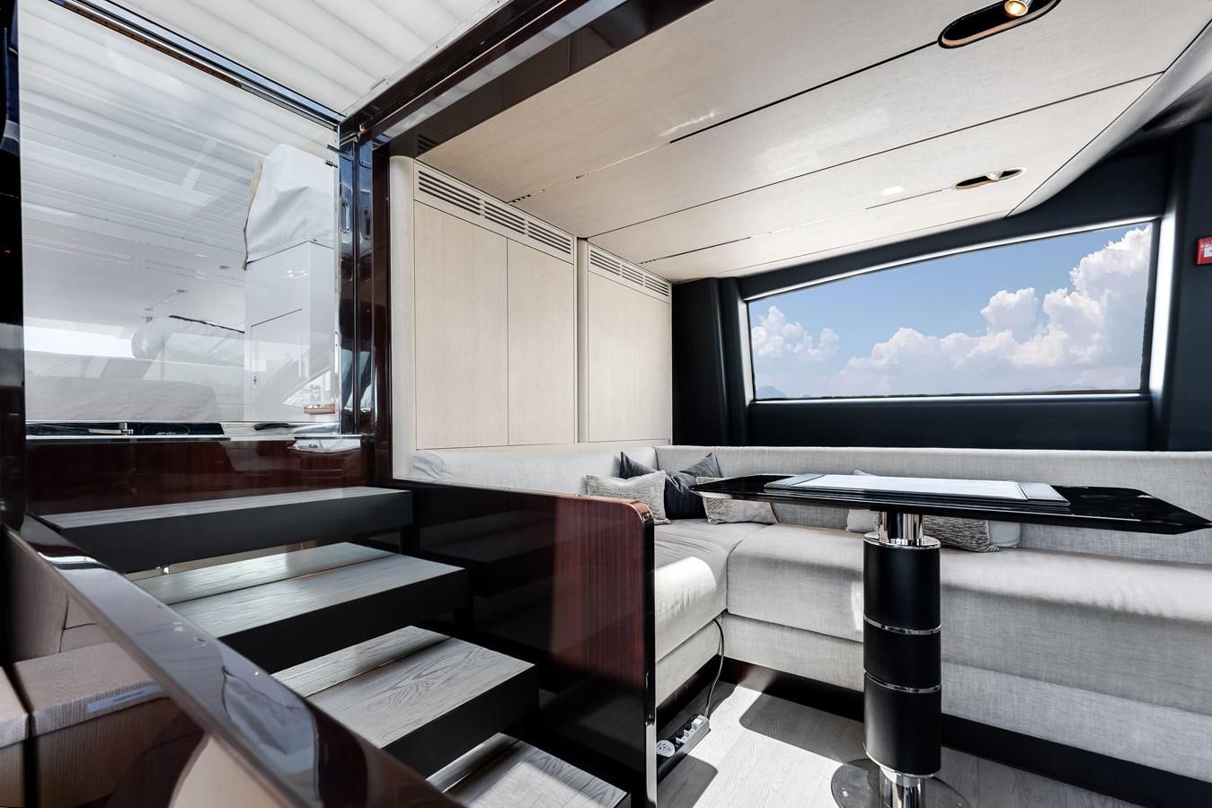 a room with a large window aboard AMICO Yacht for Sale