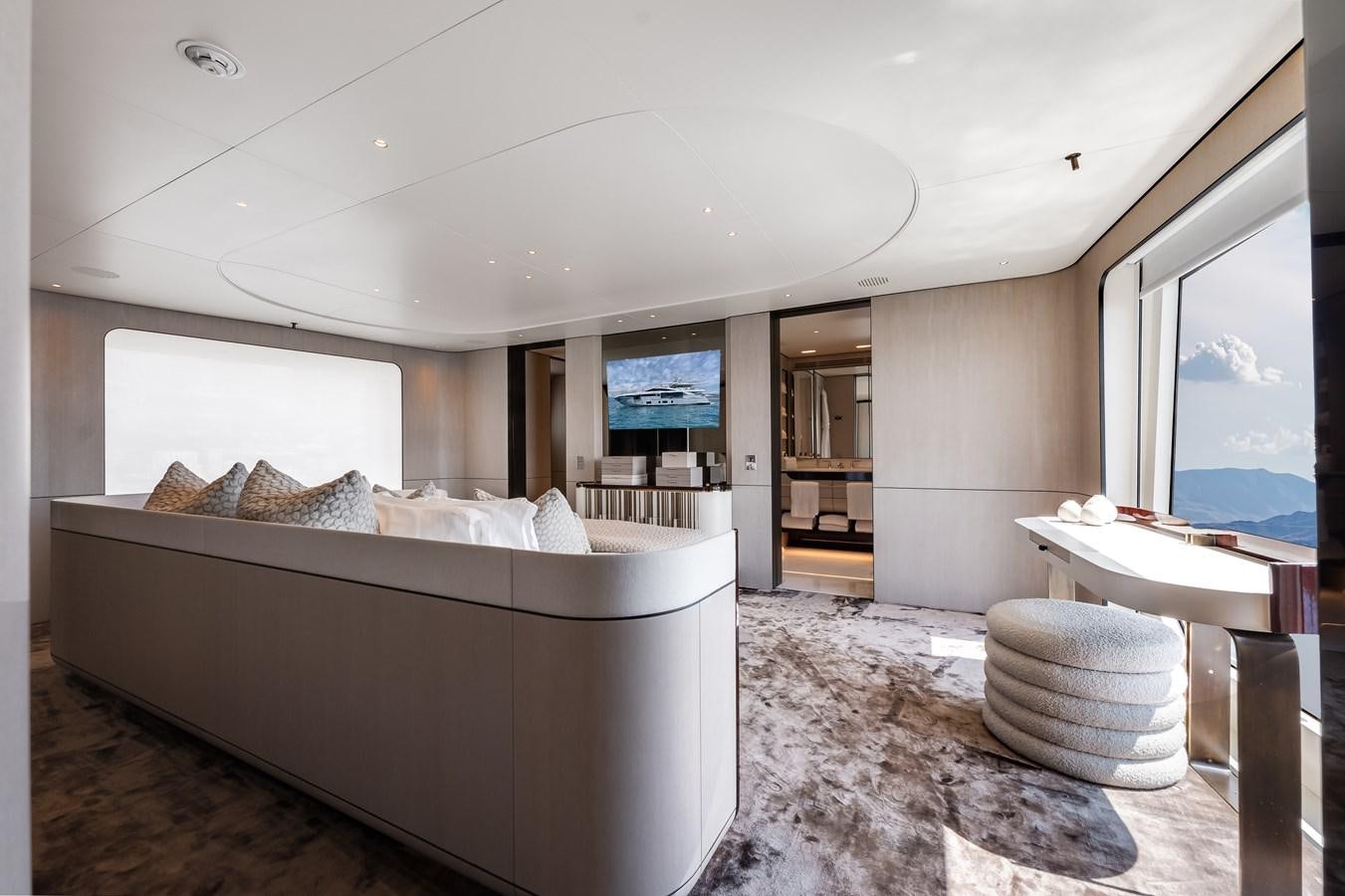a large bedroom with a large bed aboard AMICO Yacht for Sale