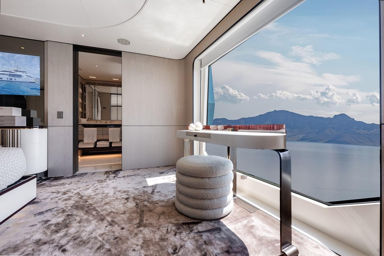 a room with a table and chairs aboard AMICO Yacht for Sale