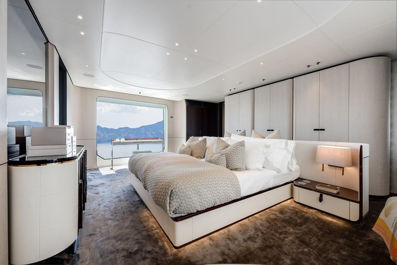 a bedroom with a large bed aboard AMICO Yacht for Sale