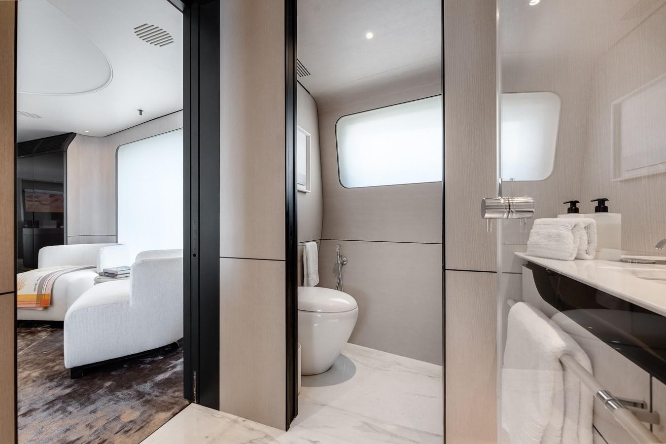a bathroom with a large mirror aboard AMICO Yacht for Sale
