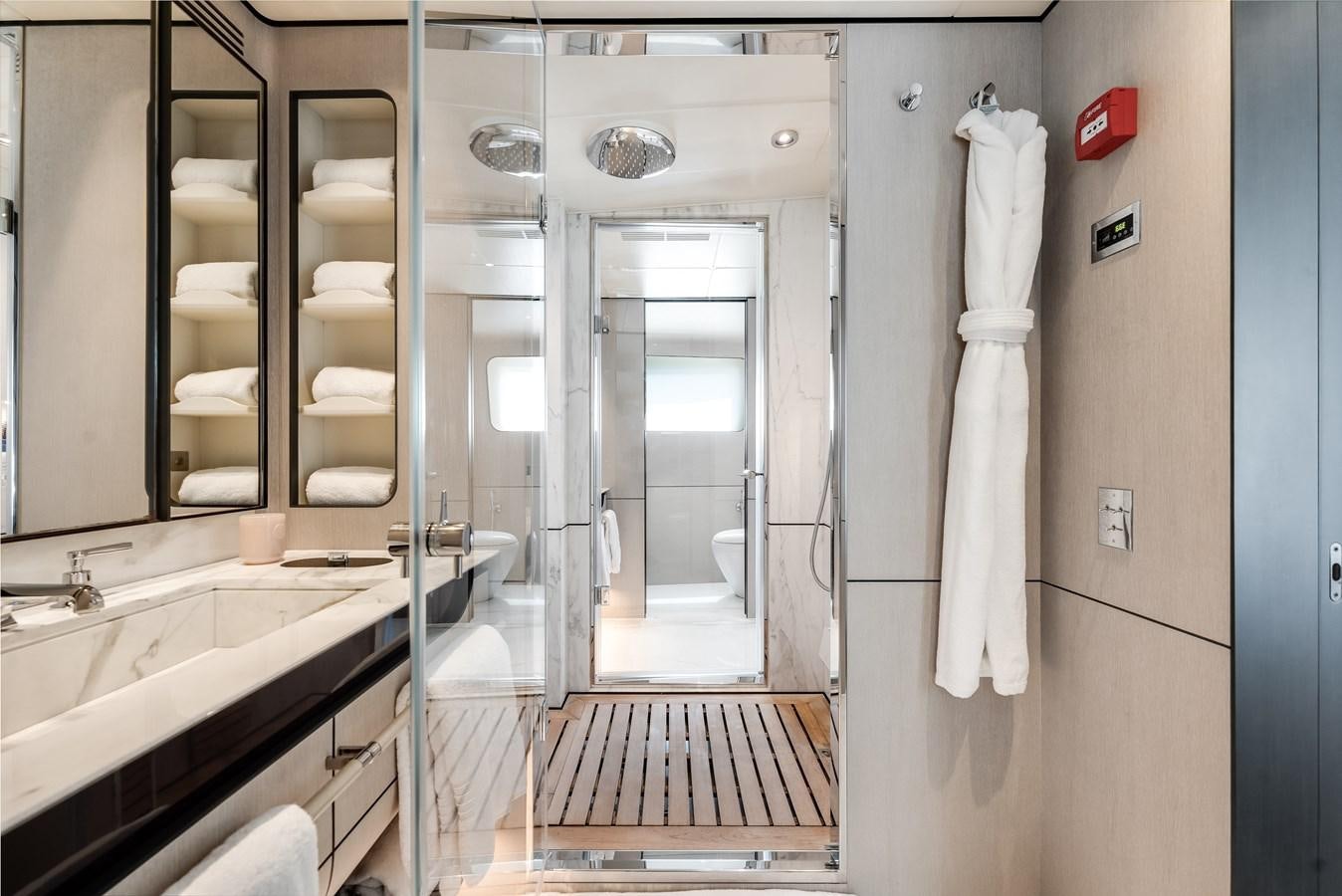 a bathroom with a sink and a mirror aboard AMICO Yacht for Sale