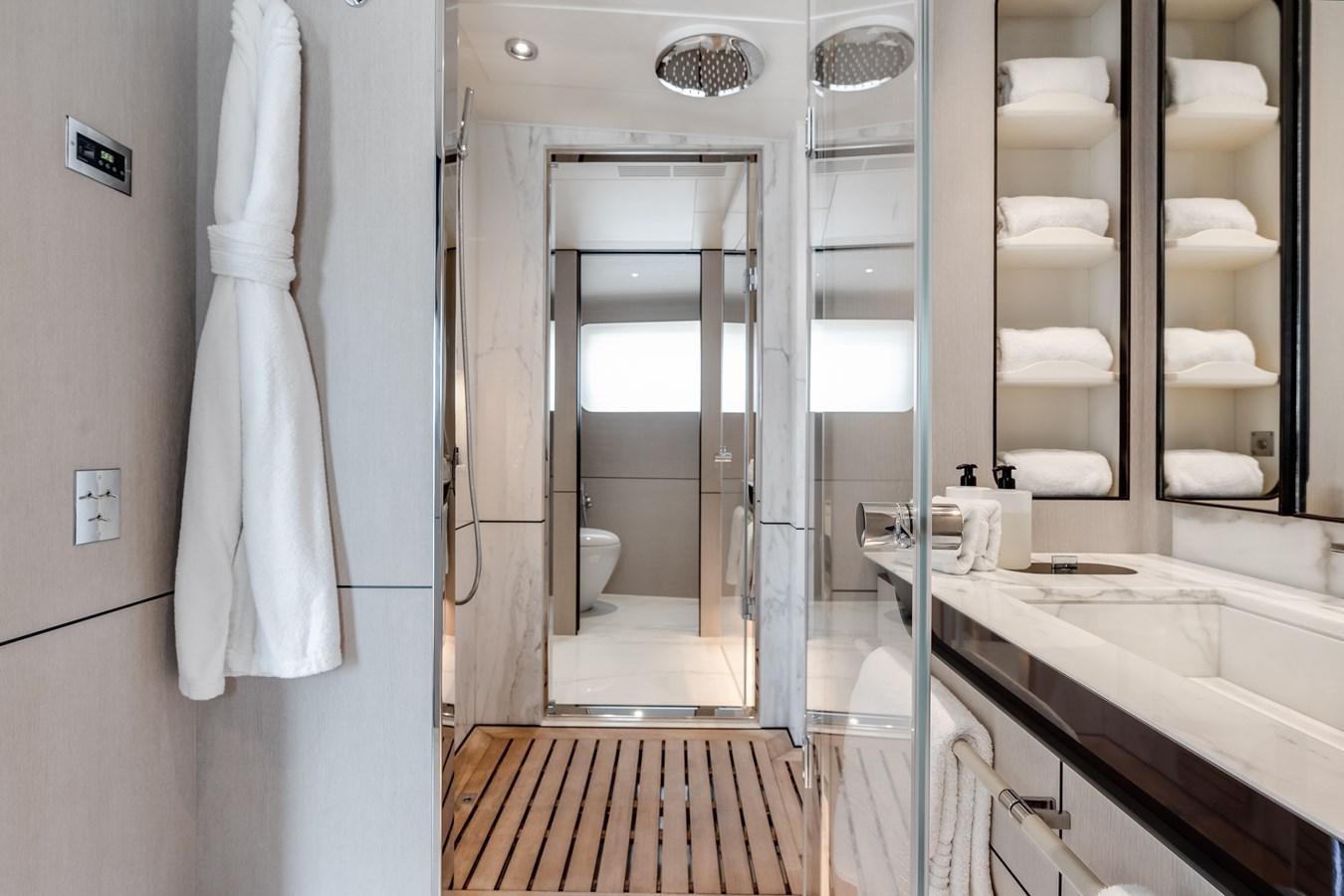 a bathroom with a glass shower aboard AMICO Yacht for Sale
