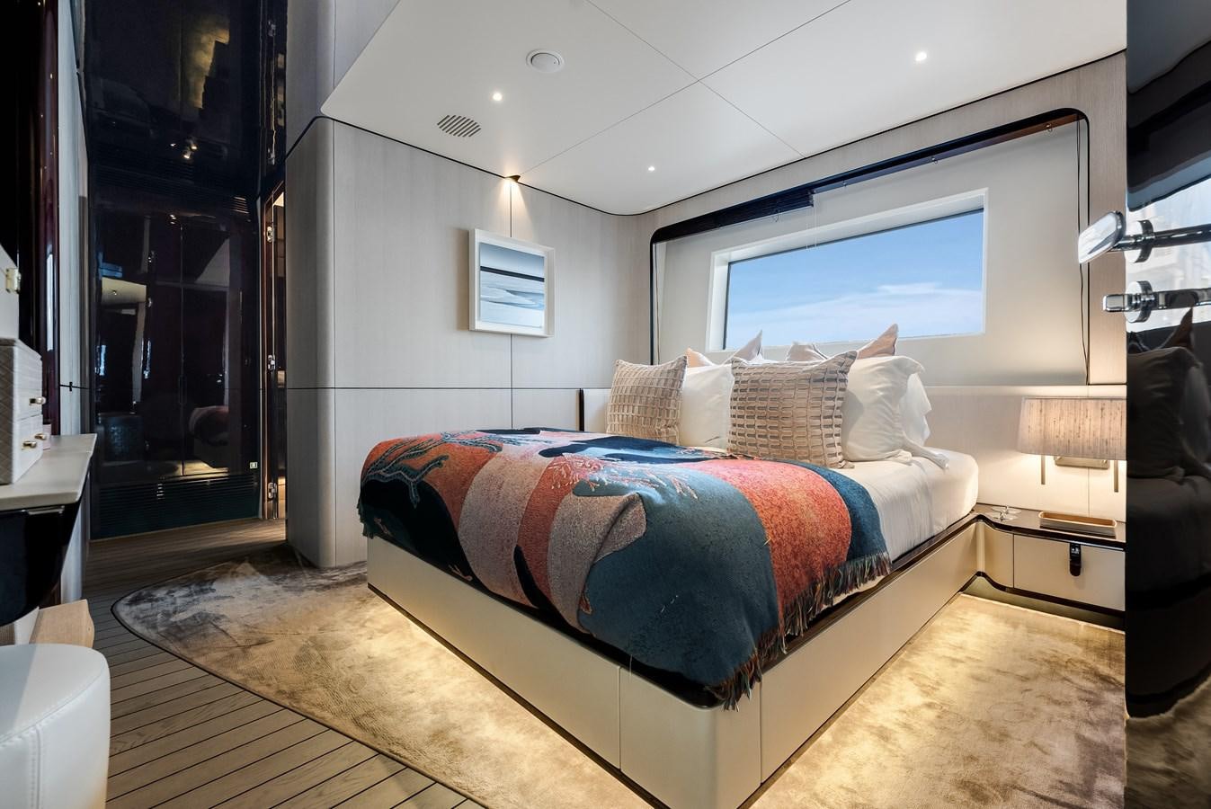 a bed in a room aboard AMICO Yacht for Sale