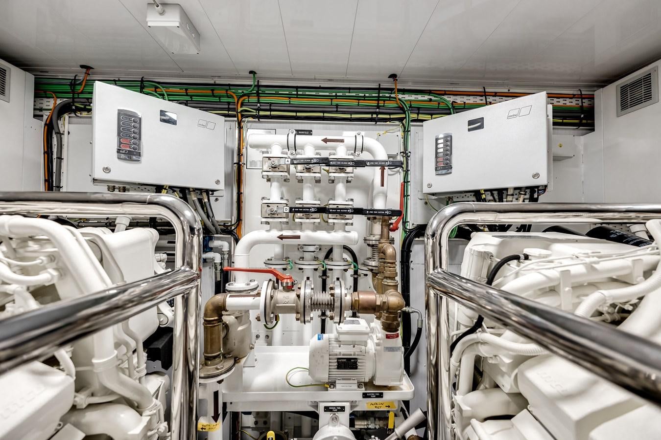 a room with several machines aboard AMICO Yacht for Sale