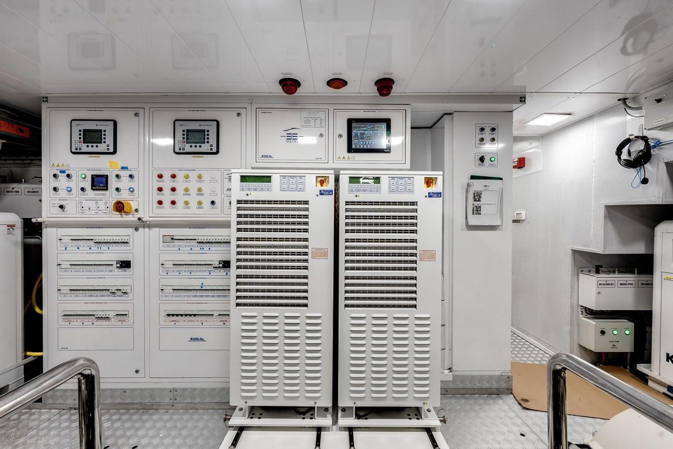 a room with several computer servers aboard AMICO Yacht for Sale