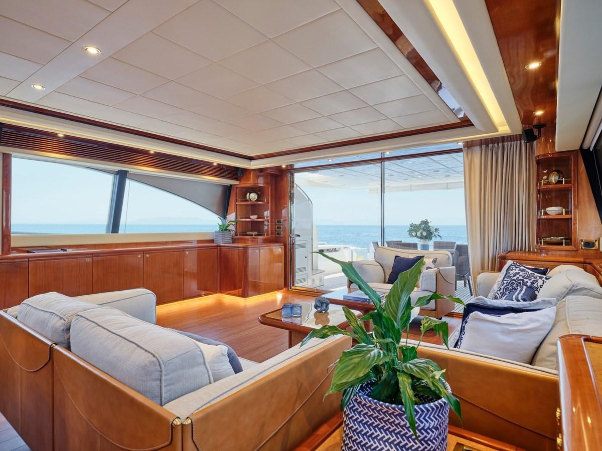 a living room with a couch and a table aboard ESTIA YI Yacht for Sale