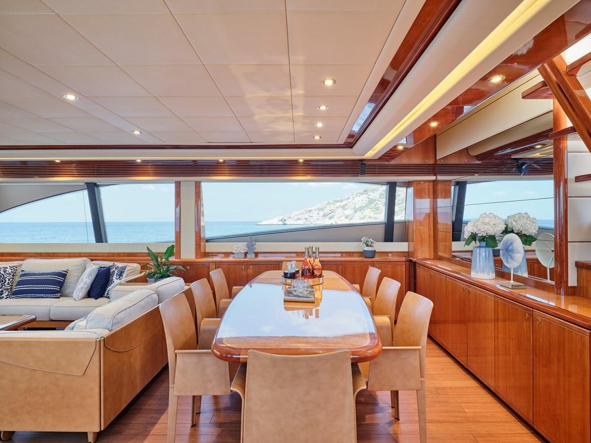 a room with a table and chairs aboard ESTIA YI Yacht for Sale