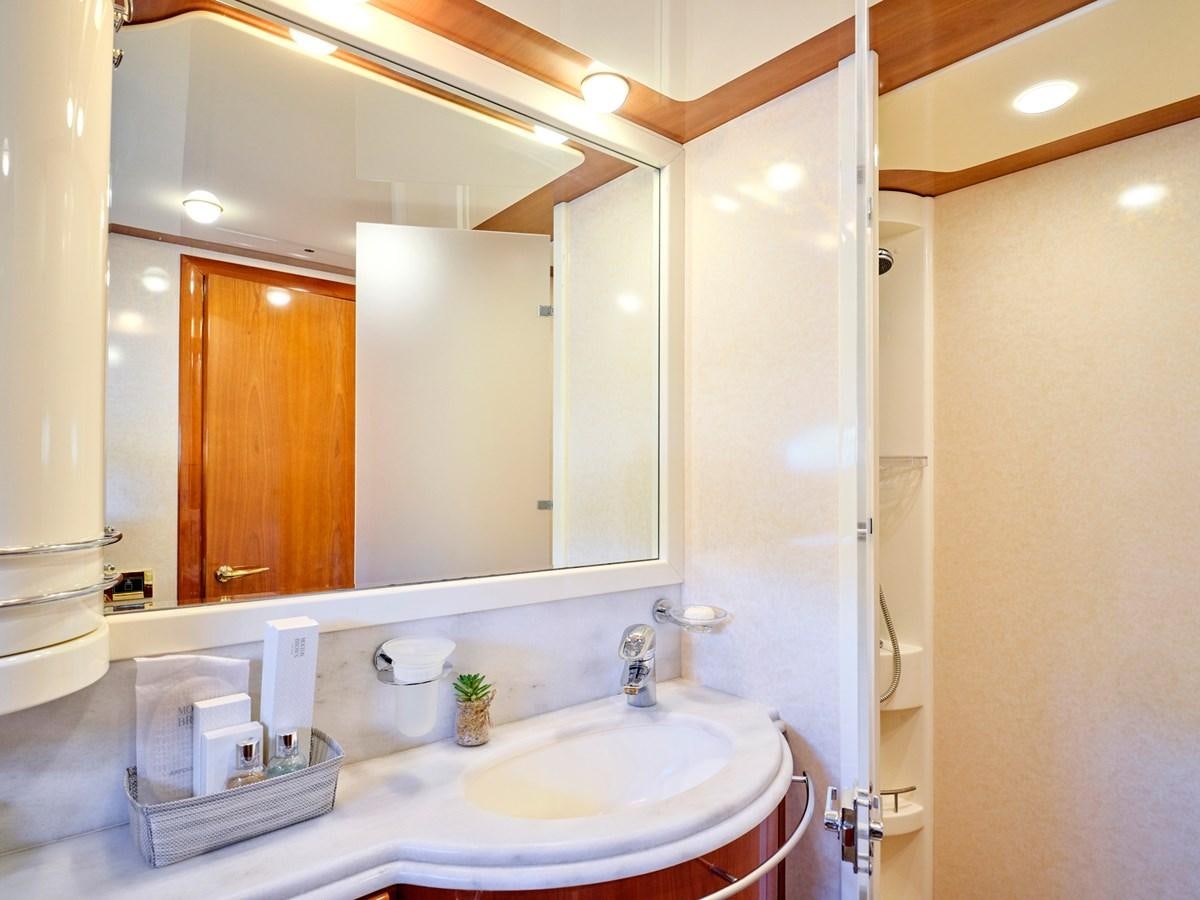 a bathroom with a large mirror aboard ESTIA YI Yacht for Sale