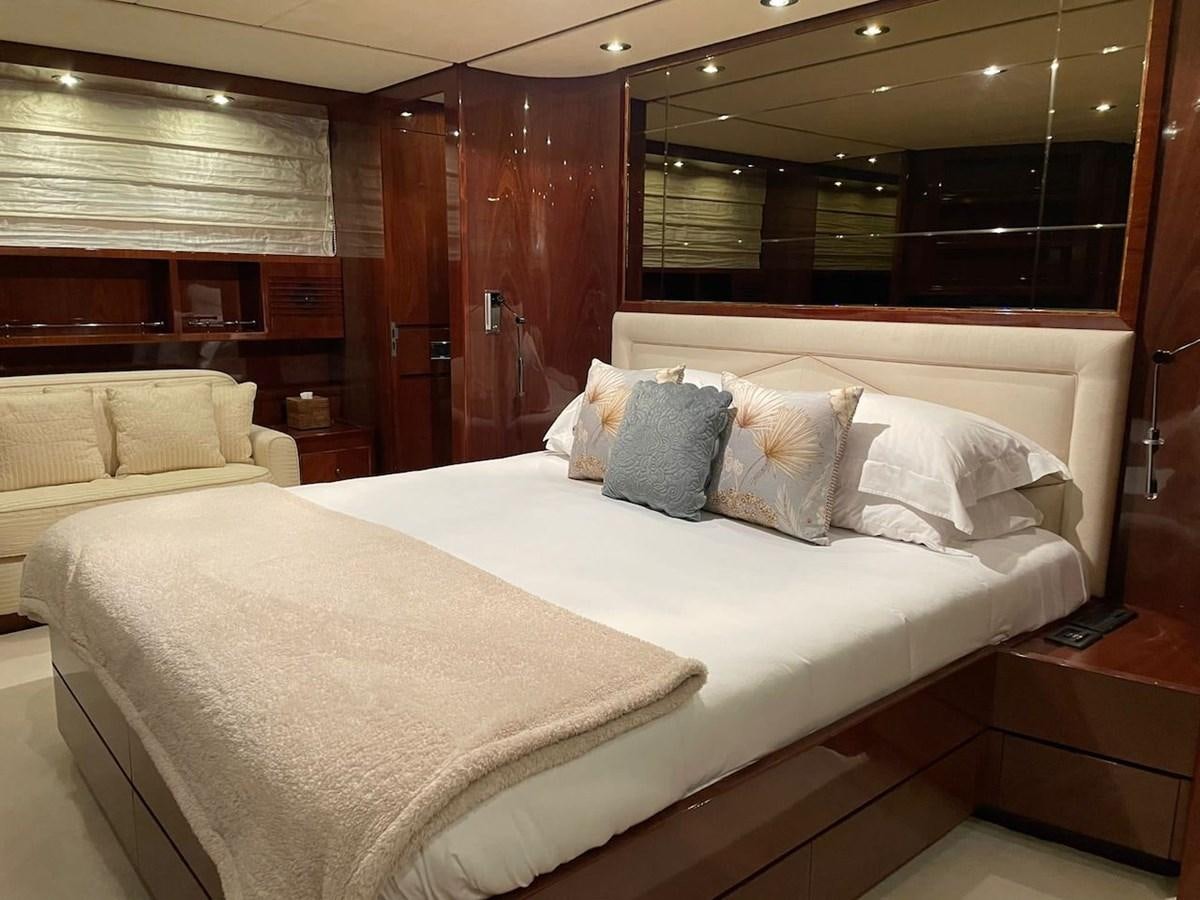 a bed with pillows aboard SKYLINE Yacht for Sale