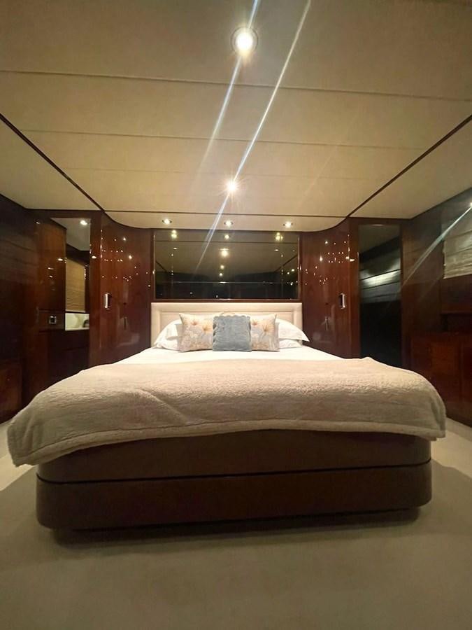 a bed in a room aboard SKYLINE Yacht for Sale