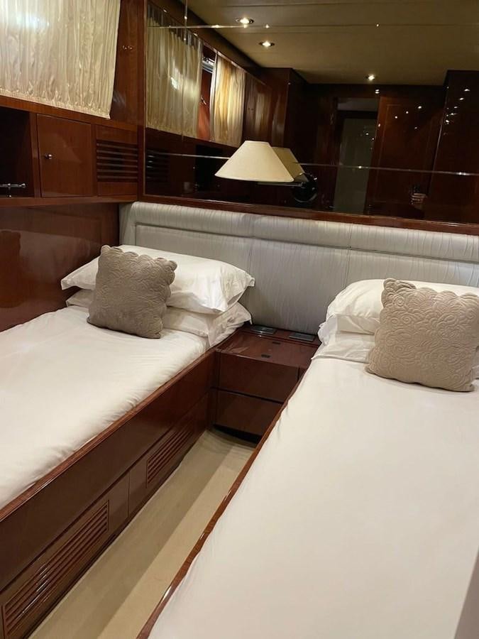 a couple of beds in a hotel room aboard SKYLINE Yacht for Sale