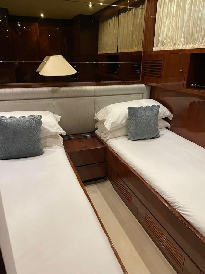a couple of beds in a hotel room aboard SKYLINE Yacht for Sale