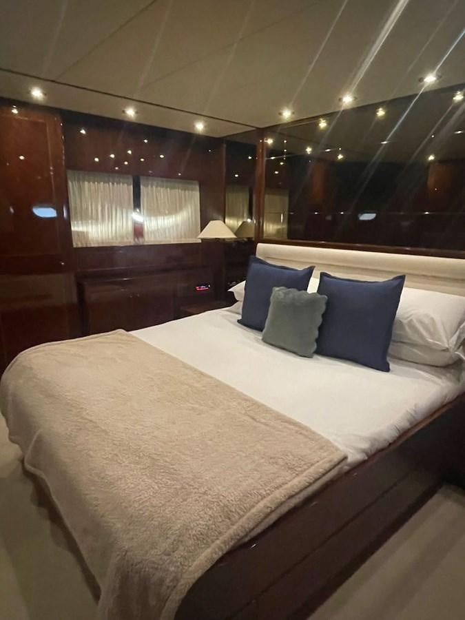 a bed with pillows on it aboard SKYLINE Yacht for Sale