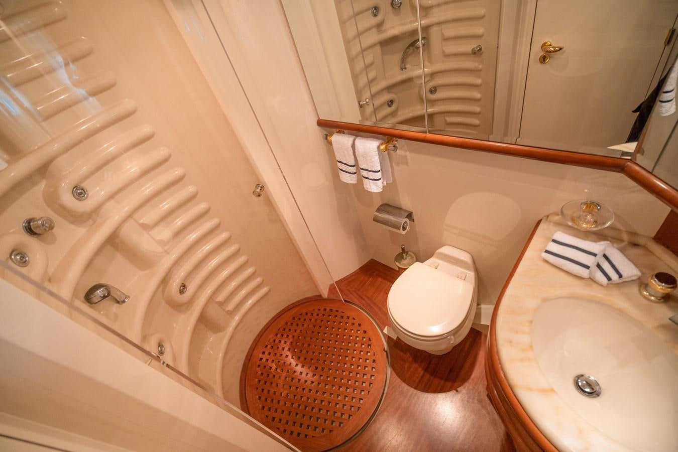a bathroom with a tub sink and toilet aboard ESTIA ZEUS Yacht for Sale