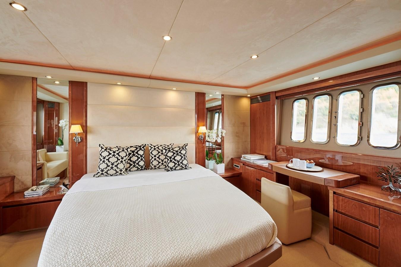 a bedroom with a large bed aboard ESTIA ONE Yacht for Sale