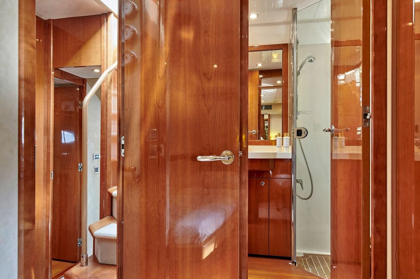 a bathroom with wooden doors aboard ESTIA ONE Yacht for Sale