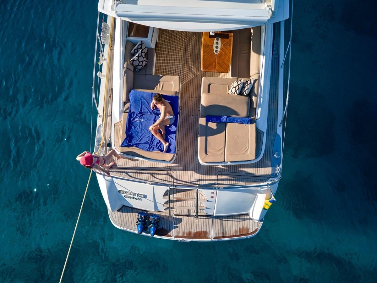a person sitting on a boat aboard ESTIA ONE Yacht for Sale