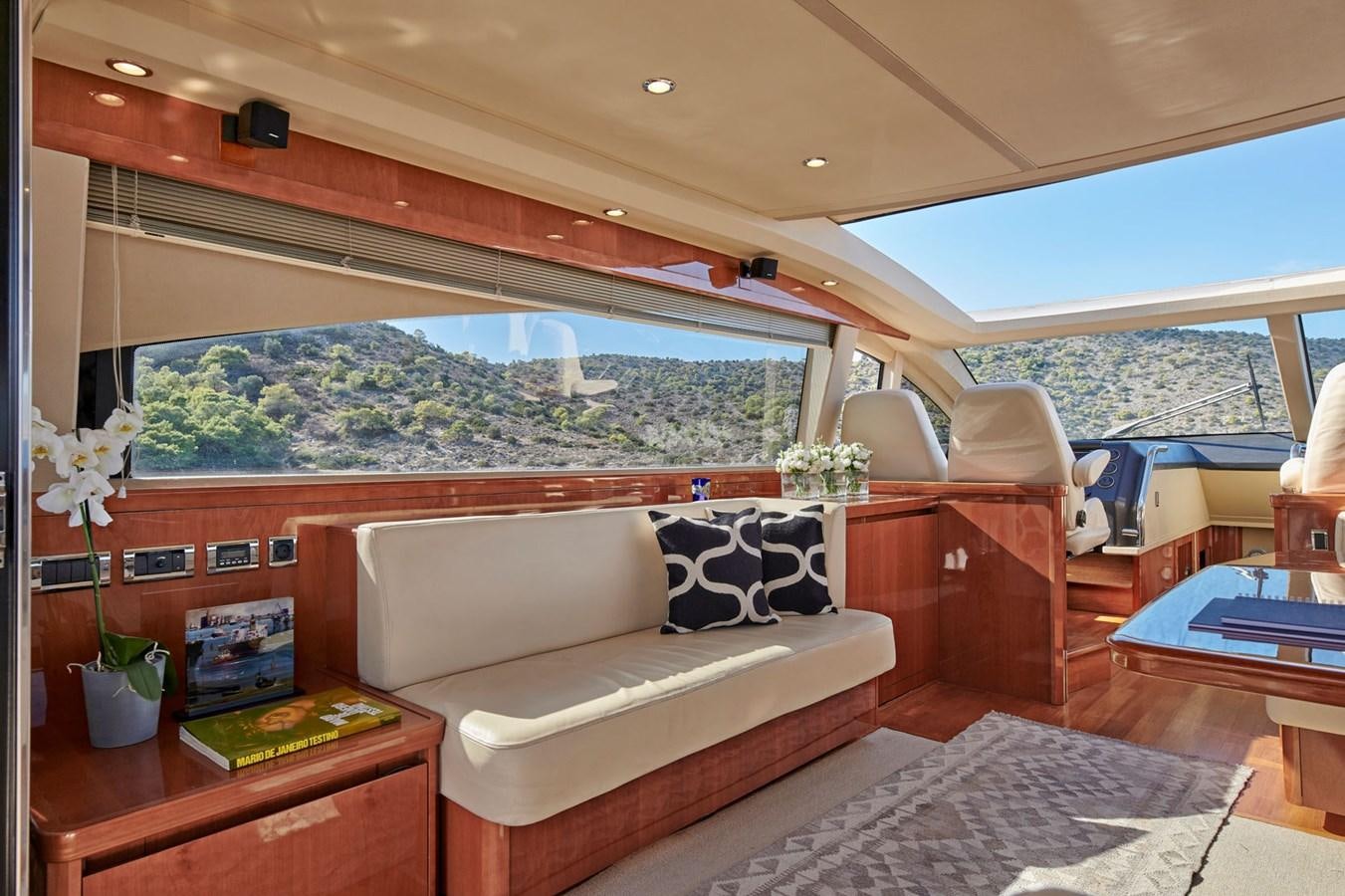 a living room with a large window aboard ESTIA ONE Yacht for Sale