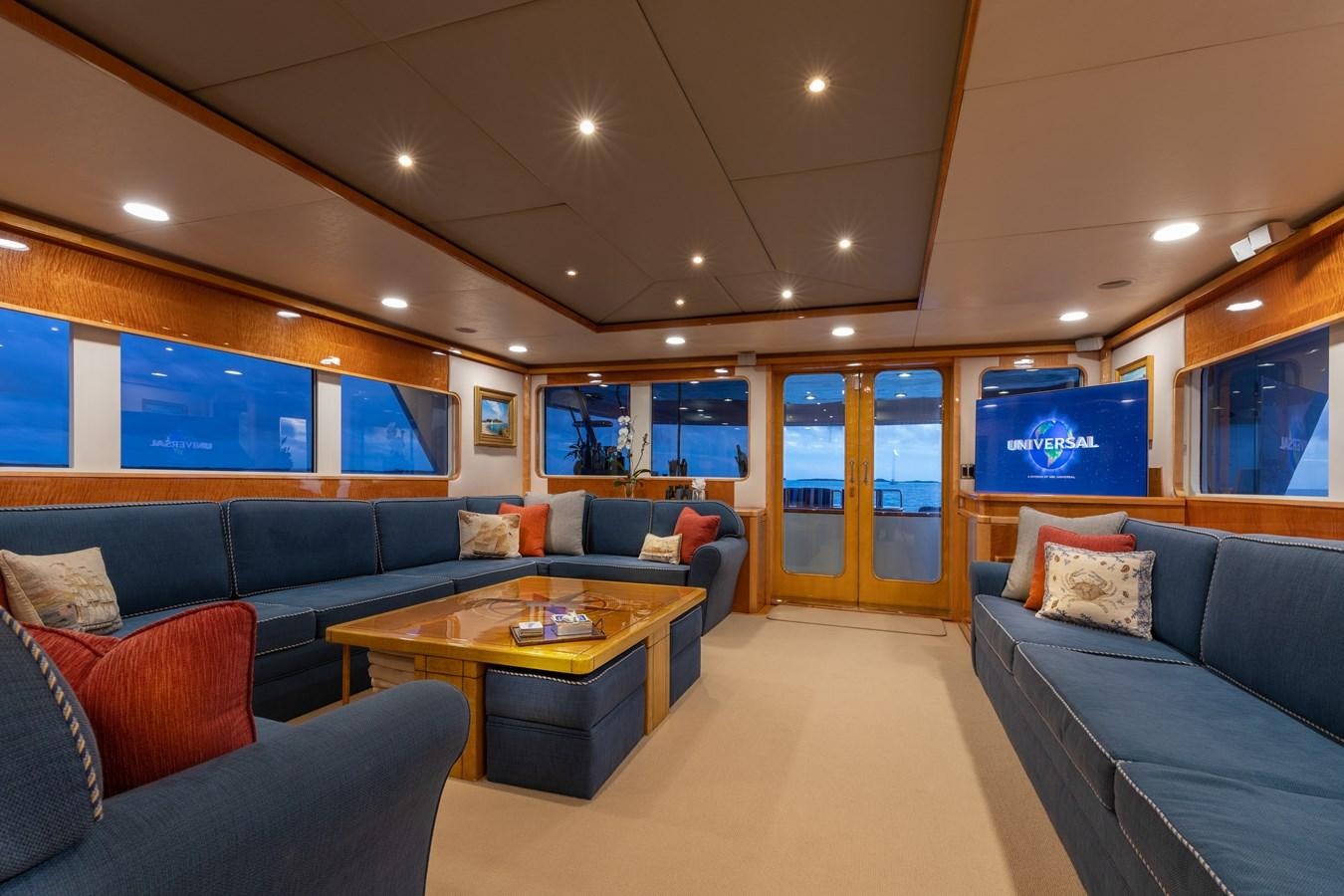 a living room with a couch and a coffee table aboard RENA Yacht for Sale